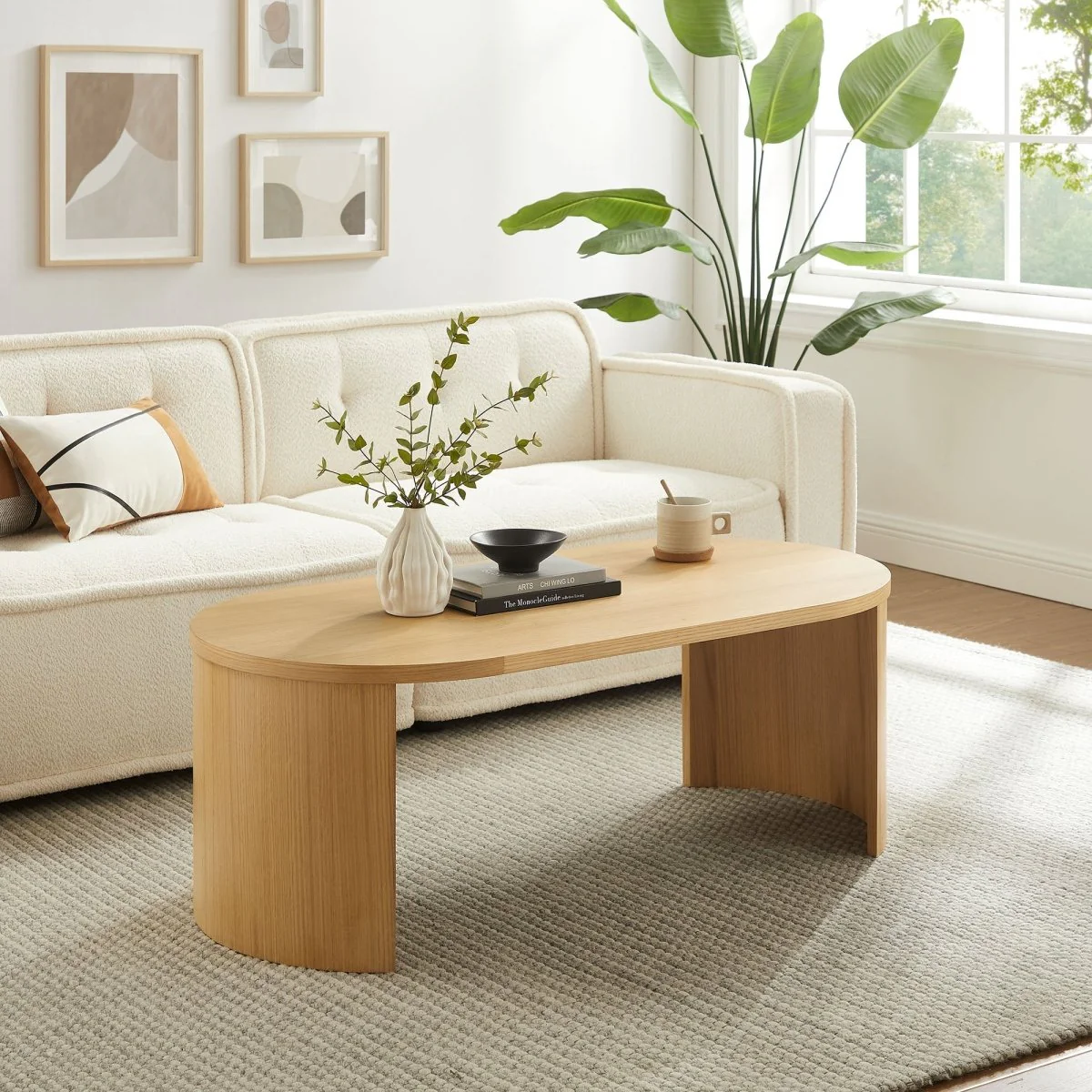 47 Inch Oval Wood Coffee Table with Reversible Arched Legs in Oak - Image 8